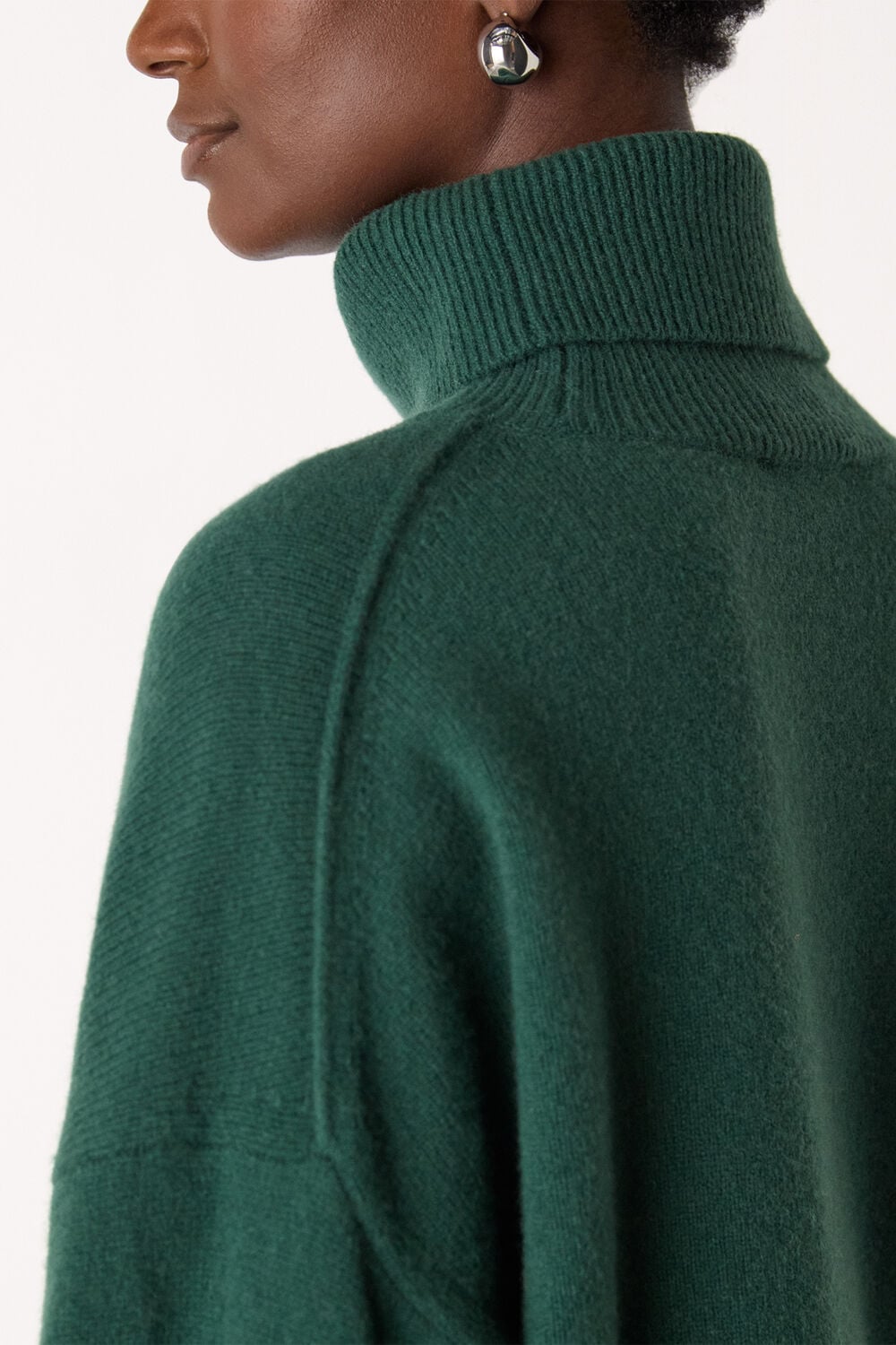 Wool Roll Curved Hem Knit