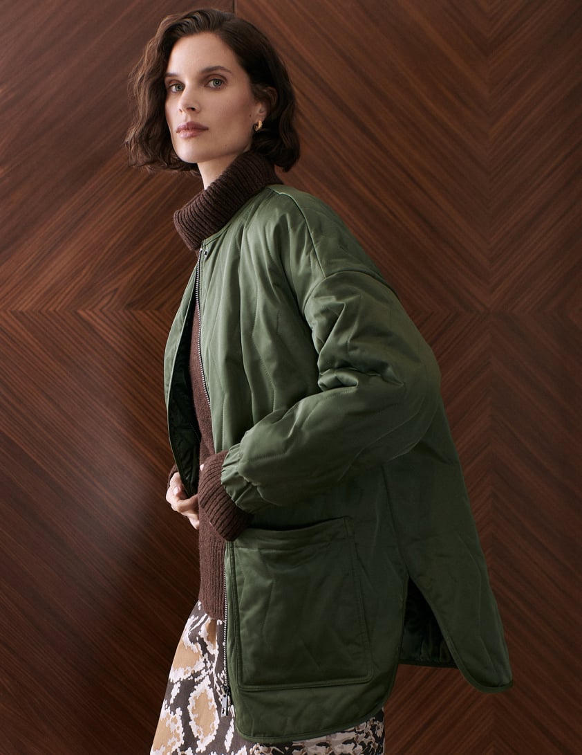 Woman wearing green jacket