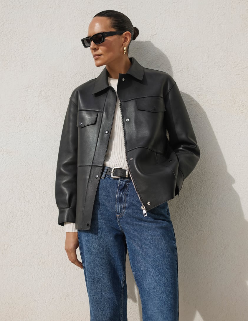 woman wearing black leather jacket and jeans