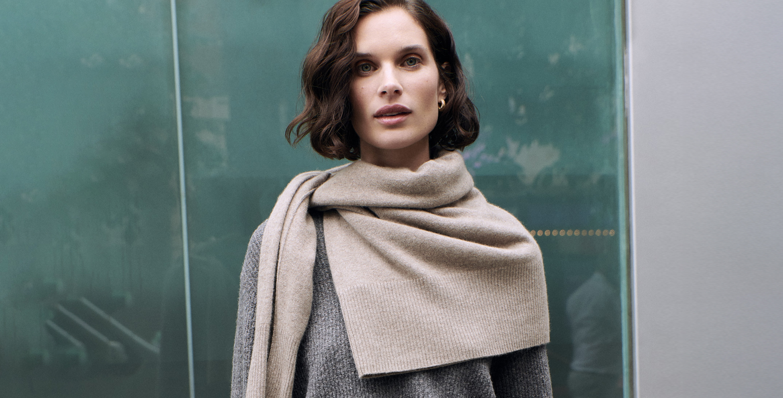 woman wearing dark grey v neck jumper