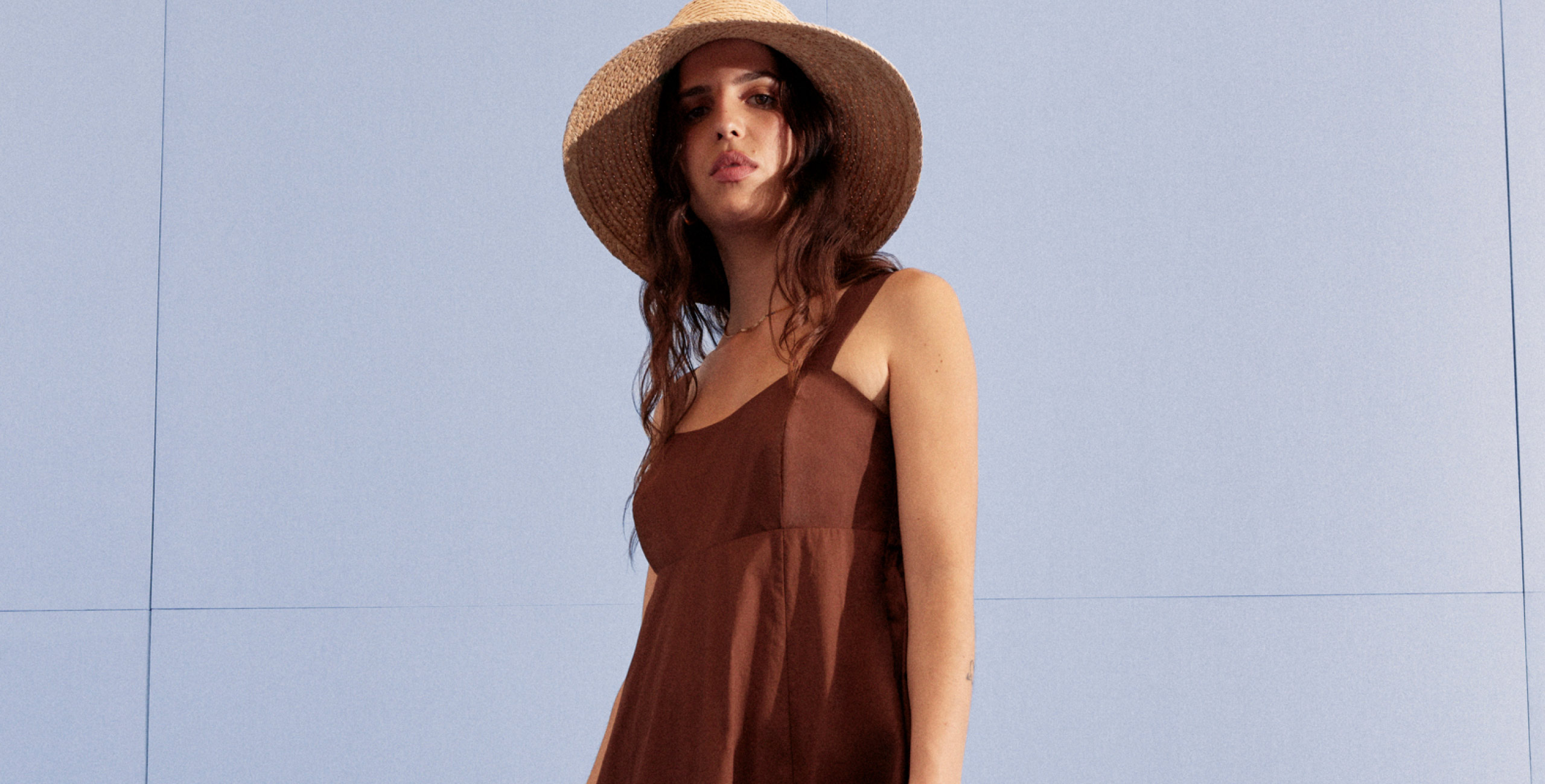 woman wearing brown linen maxi dress