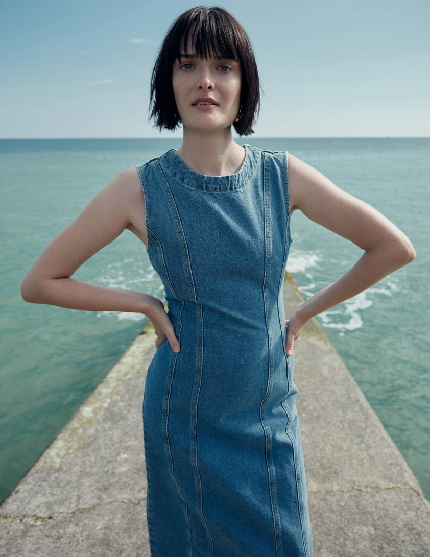 woman wearing blue denim maxi dress