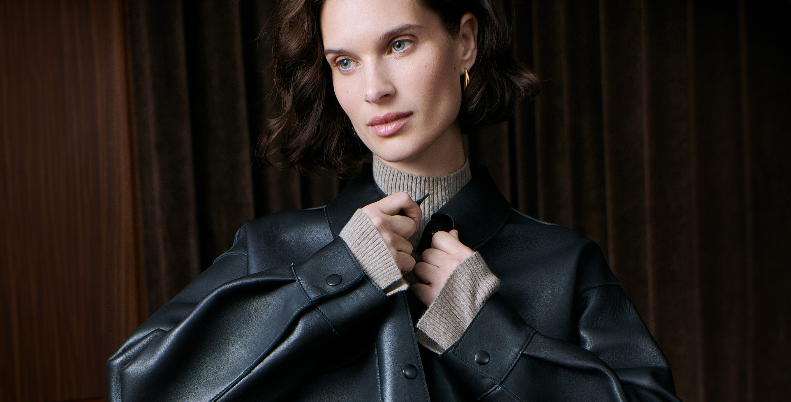 woman wearing black leather jacket