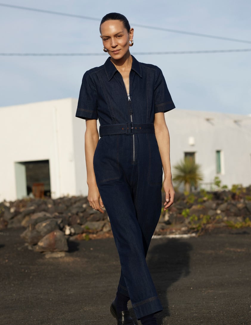 Woman wearing denim jumpsuit