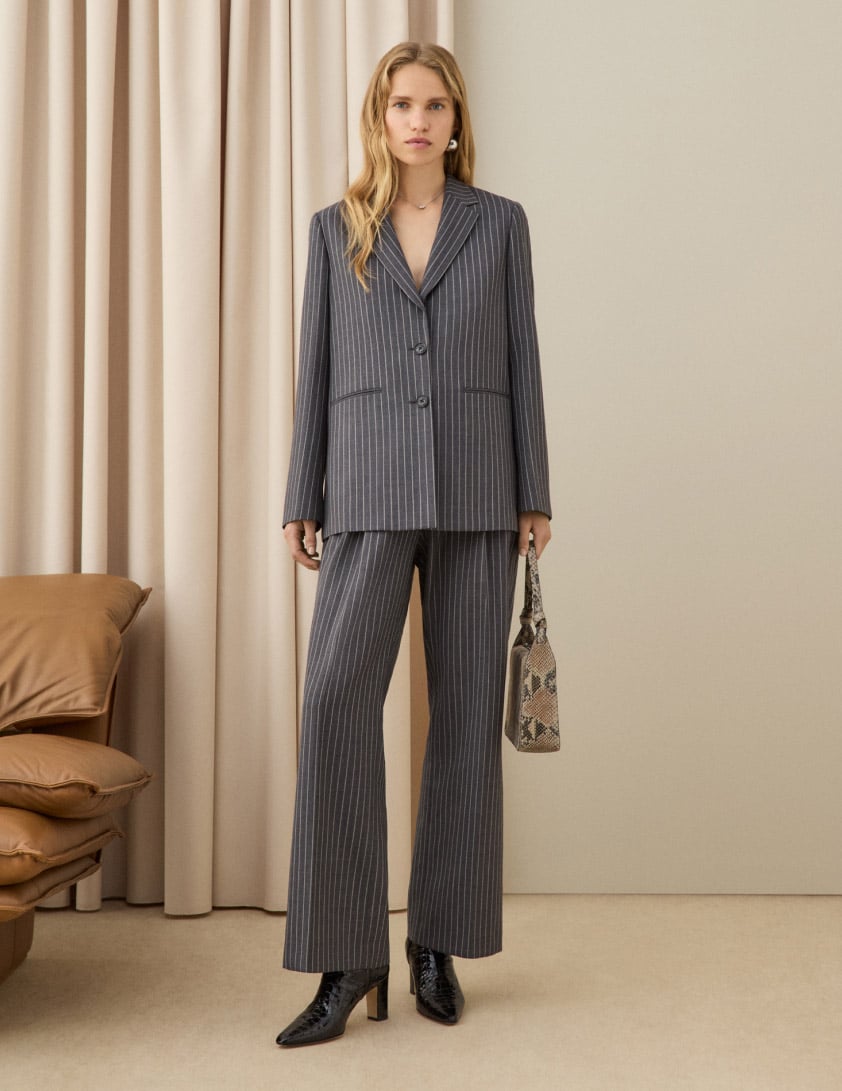 woman wearing pinstripe trouser suit