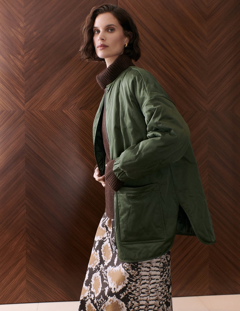 woman wearing green jacket