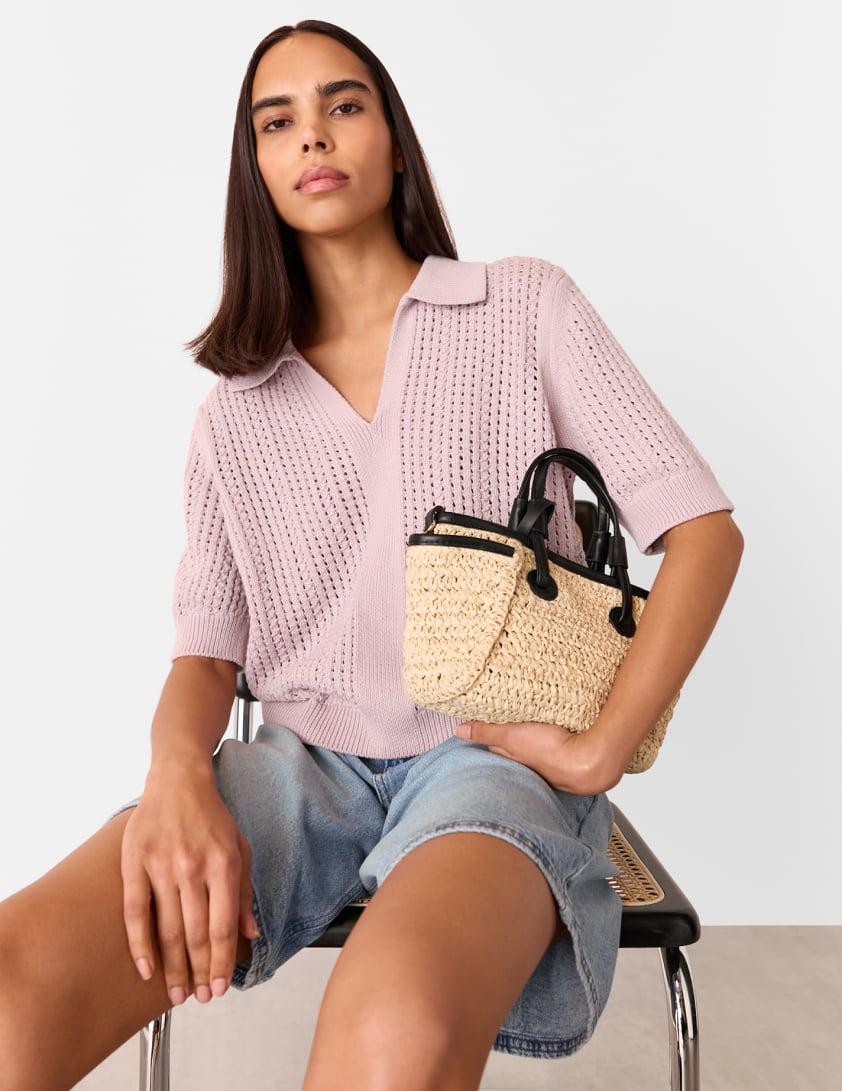 woman wearing lilac crochet top