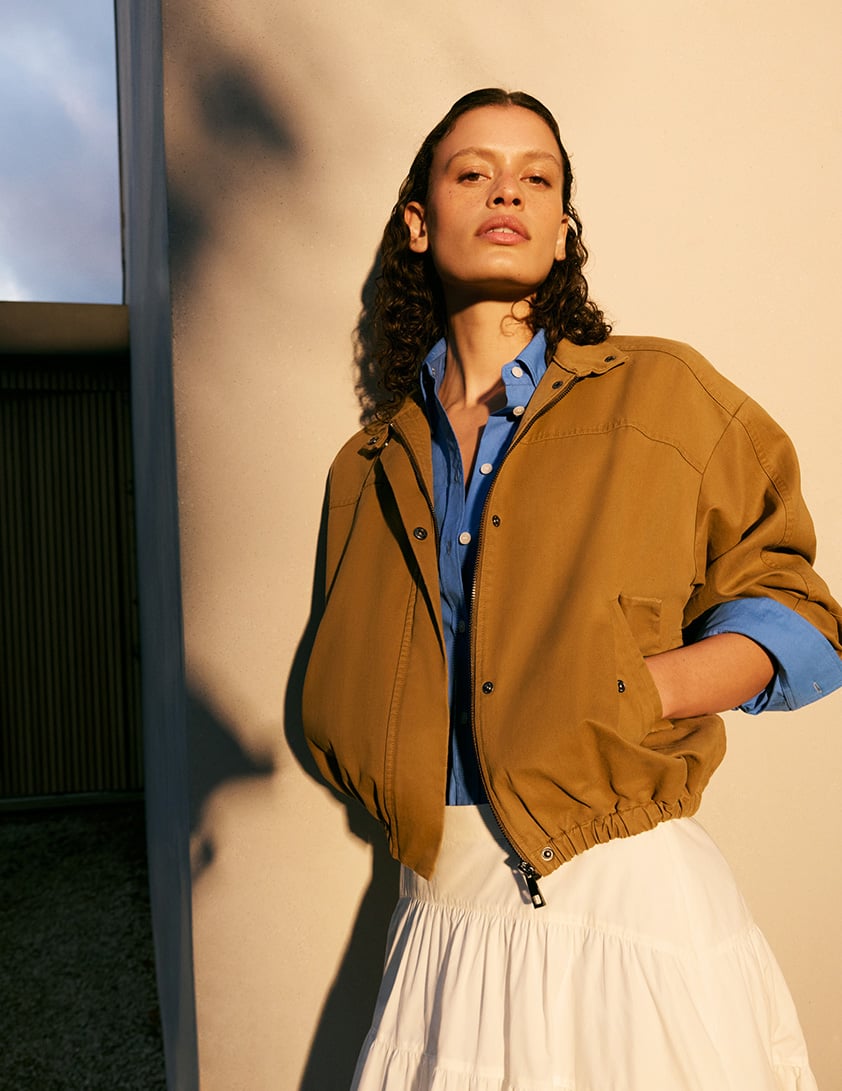 woman wearing shearling leather jacket with jeans