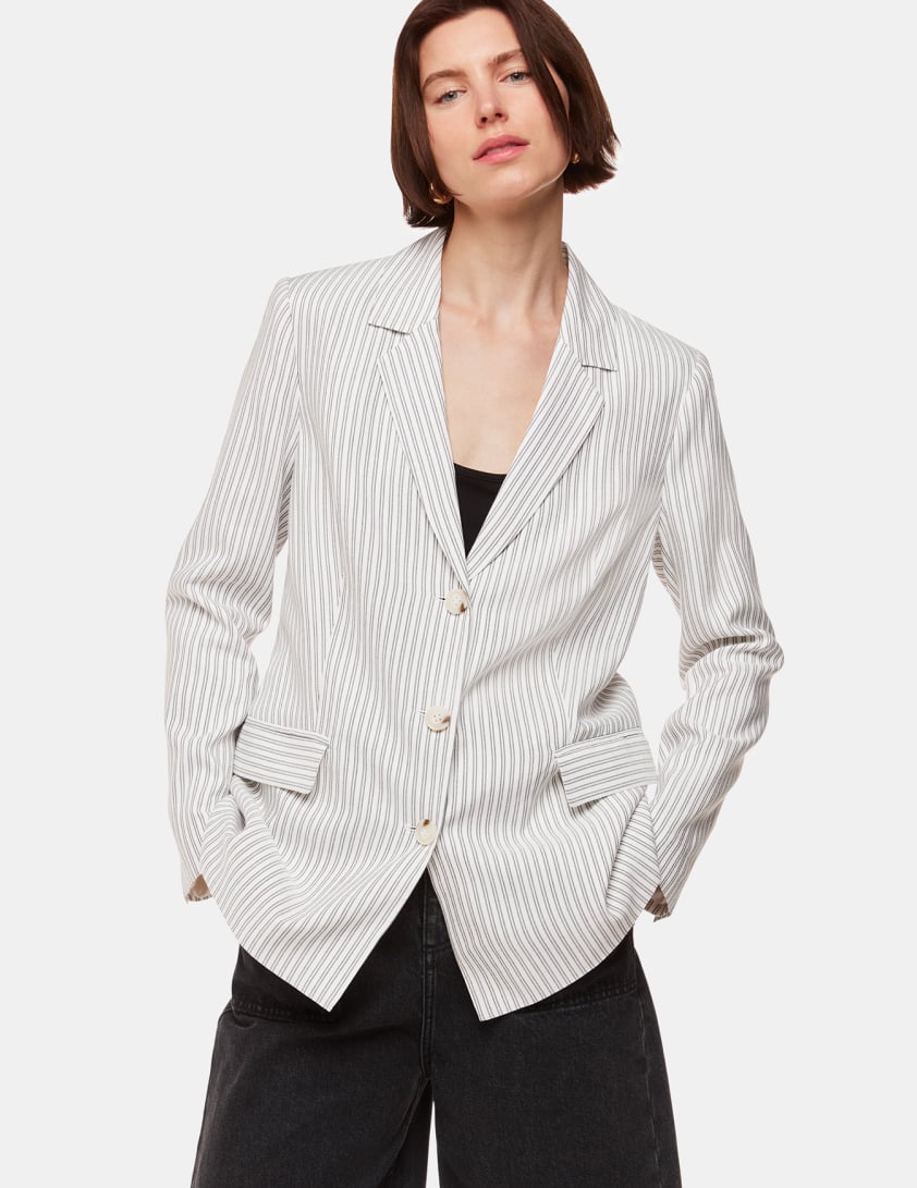 woman wearing white stripe blazer